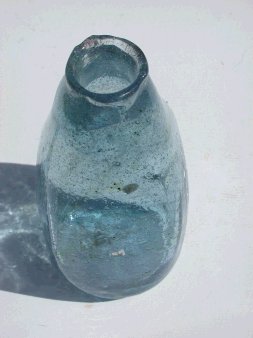 Bottle blown in square clay mold